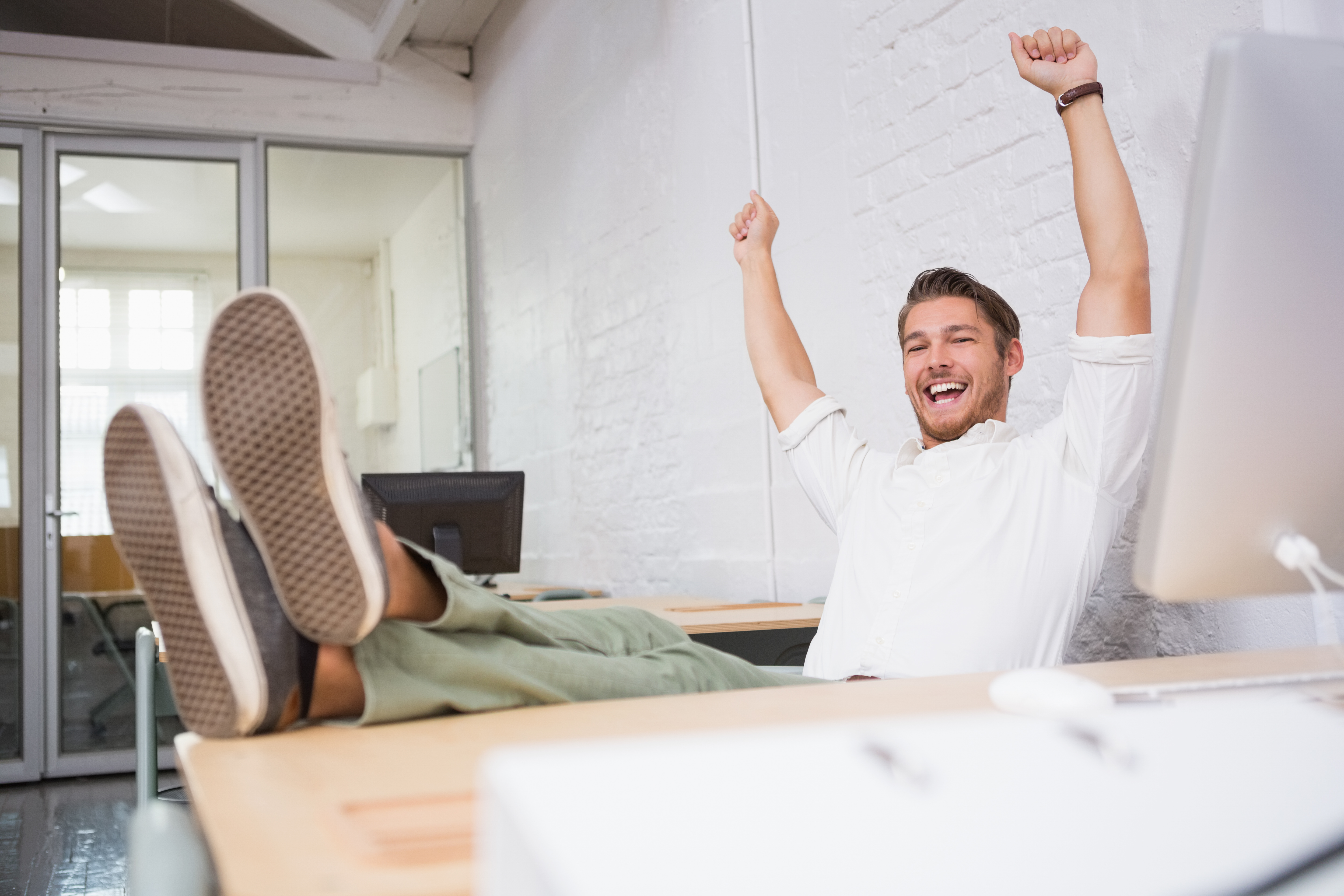 life coach cheering at desk